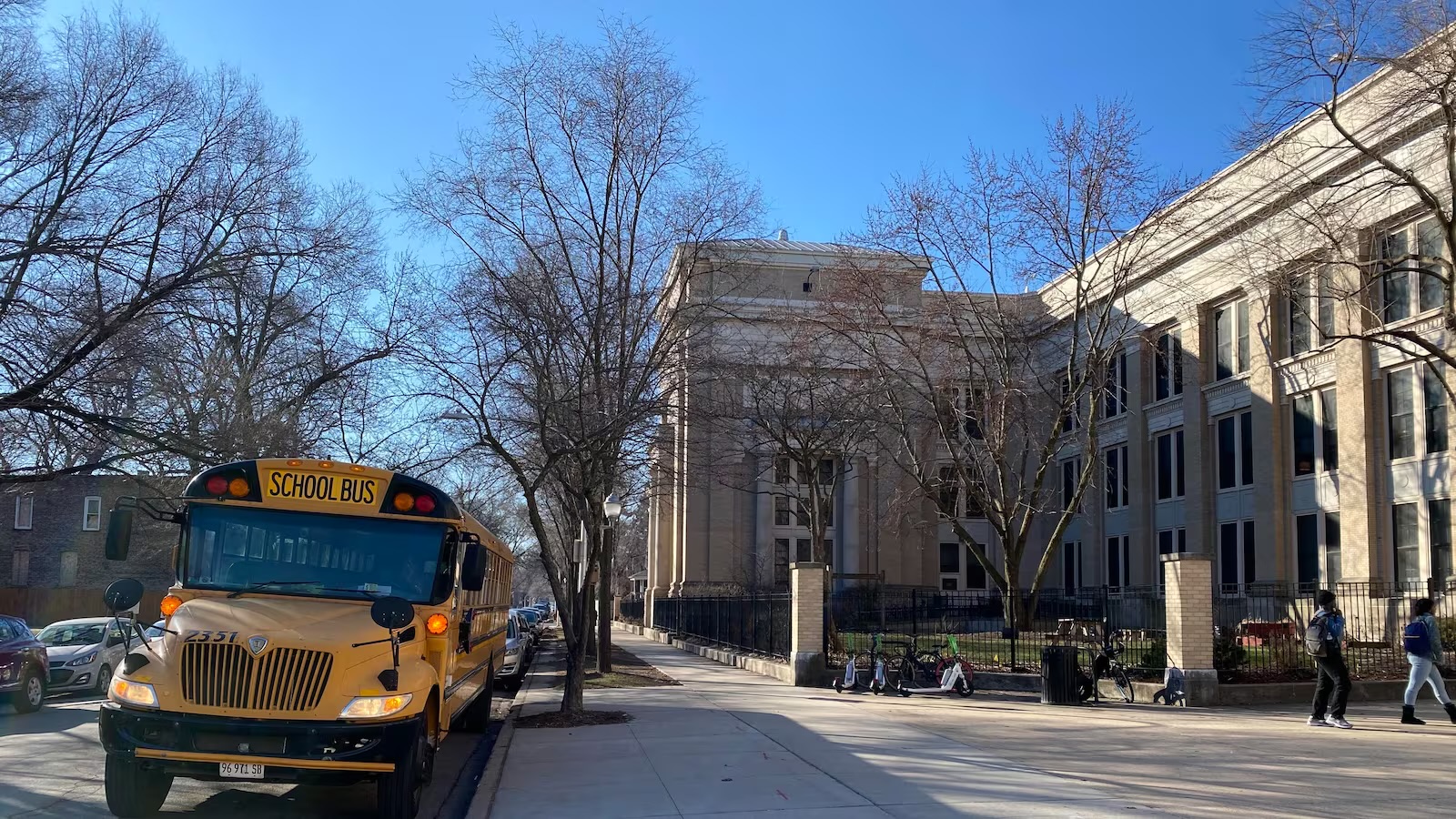 Pictured, a bus parked outside the front entrance to Lindblom Math and Science Academy on Wed., Feb. 14, 2024 in Chicago, Illinois.