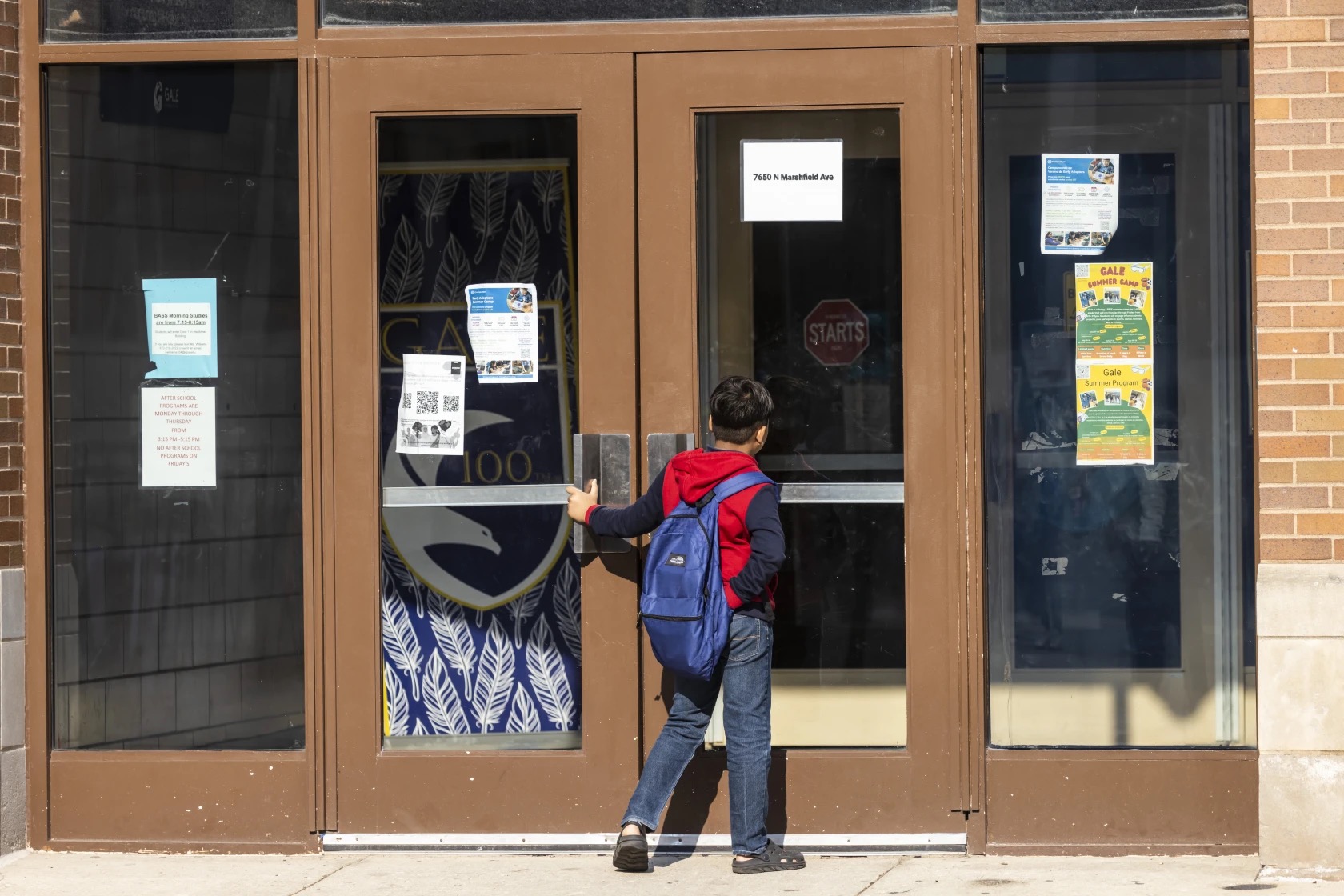A student arrives for school at the Stephen F. Gale School Annex